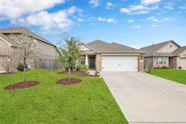 view of front of house featuring a front yard, brick siding, concrete driveway, and an attached garage