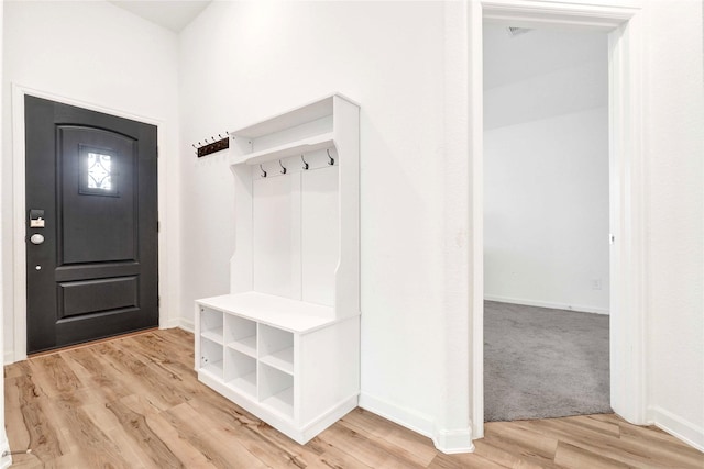 mudroom featuring light wood-type flooring and baseboards