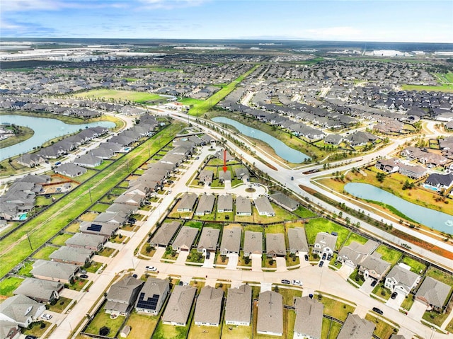 aerial view featuring a water view and a residential view