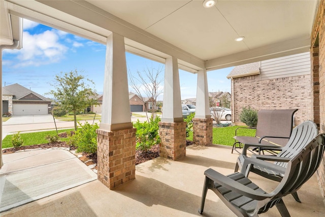 view of patio / terrace featuring a residential view and covered porch