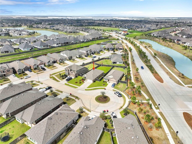 aerial view with a residential view and a water view