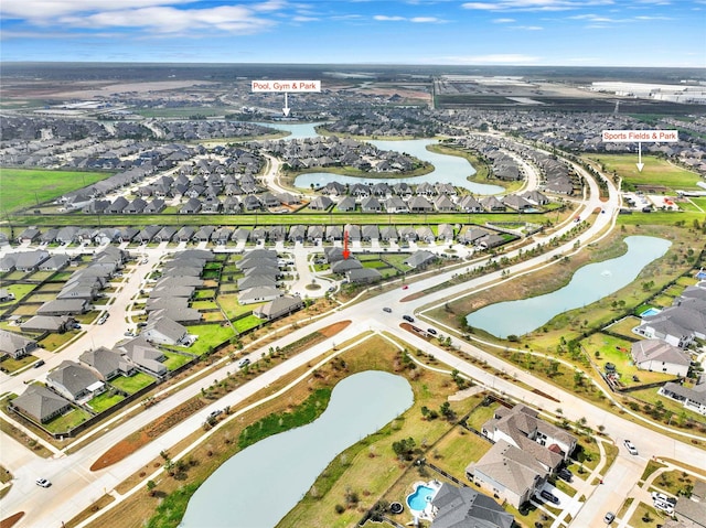 bird's eye view featuring a residential view and a water view