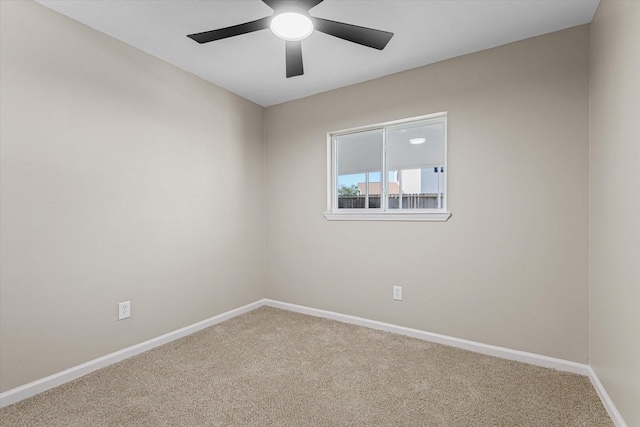 empty room with baseboards, a ceiling fan, and carpet flooring