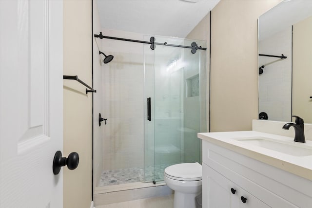 full bathroom featuring vanity, toilet, and a stall shower