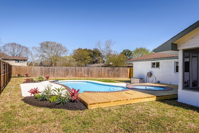 view of pool with a fenced in pool, an in ground hot tub, a lawn, and a fenced backyard