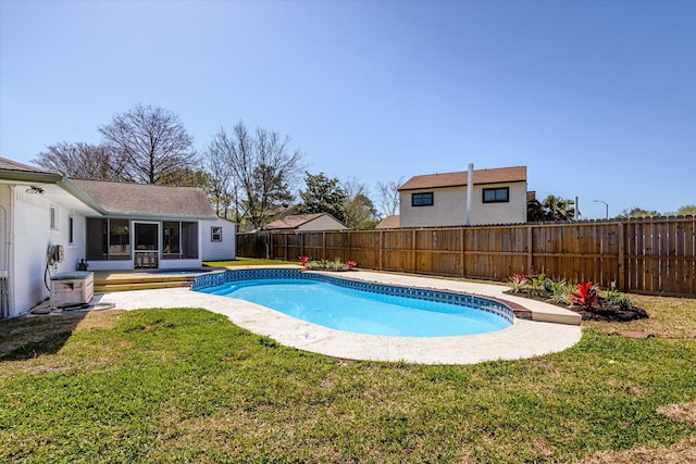 view of swimming pool with a yard, a fenced backyard, a fenced in pool, and a sunroom