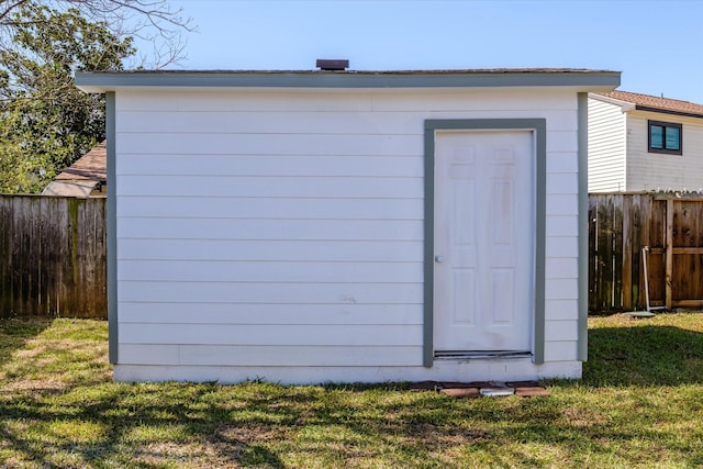 view of shed with fence