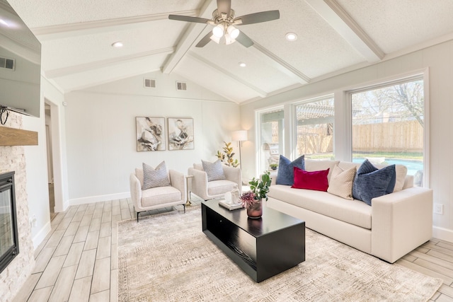 living area with vaulted ceiling with beams, visible vents, and wood finish floors