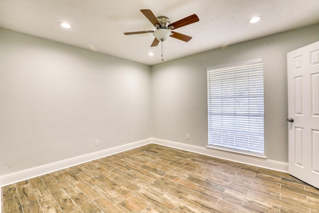 empty room featuring recessed lighting, ceiling fan, baseboards, and wood finished floors