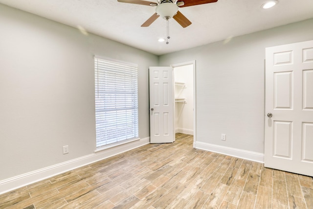 unfurnished bedroom with recessed lighting, baseboards, wood finish floors, and ceiling fan