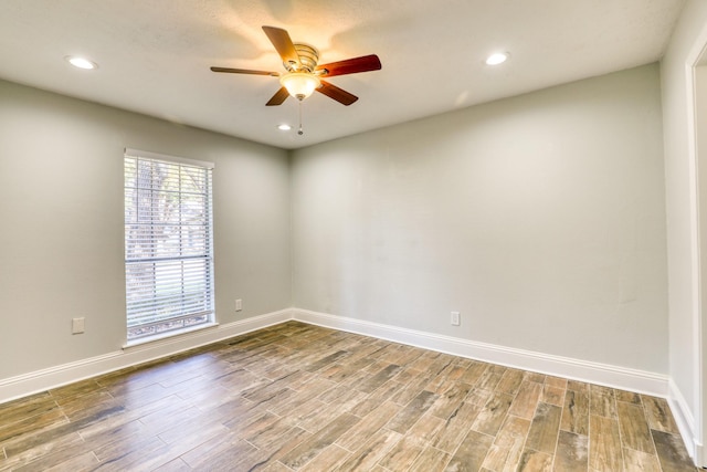 unfurnished room featuring ceiling fan, baseboards, wood finished floors, and recessed lighting