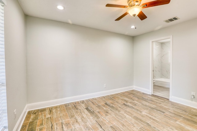 unfurnished room with light wood-type flooring, visible vents, baseboards, and ceiling fan