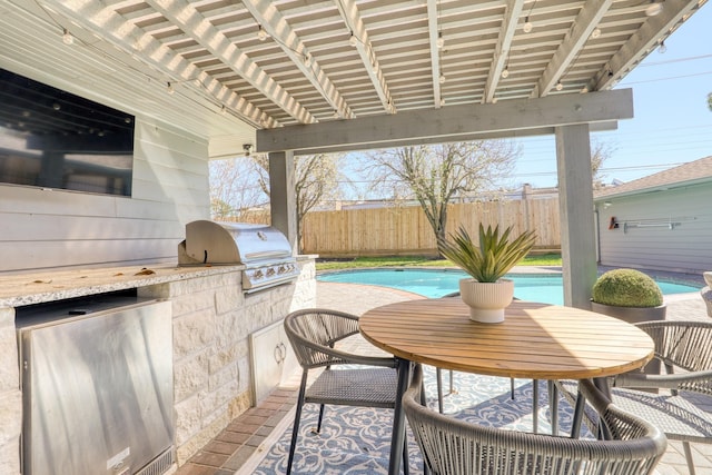 view of patio with area for grilling, a fenced in pool, outdoor dining space, and fence