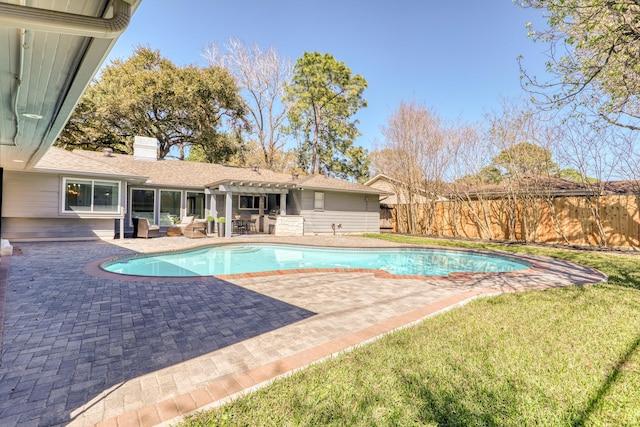 view of swimming pool featuring a patio area, fence, a fenced in pool, and a pergola