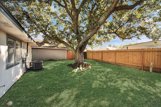 view of yard with cooling unit and a fenced backyard