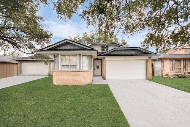 view of front of home with a front lawn, an attached garage, brick siding, and driveway