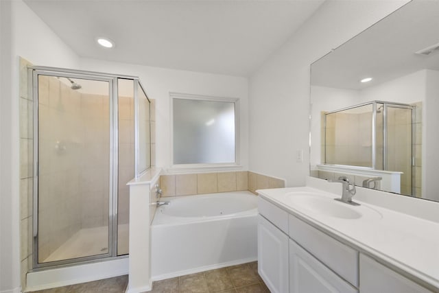 full bath featuring tile patterned floors, visible vents, a garden tub, a shower stall, and vanity