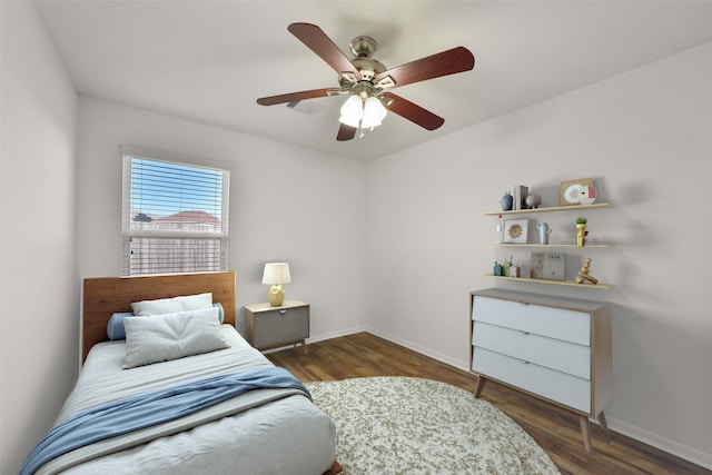 bedroom with wood finished floors, baseboards, and ceiling fan