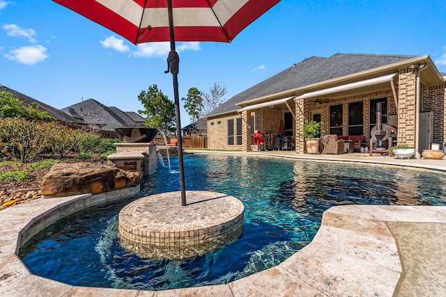 view of pool with a fenced in pool, a patio, a ceiling fan, and fence