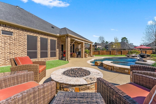 view of swimming pool featuring a patio, a fenced in pool, an outdoor fire pit, an in ground hot tub, and a fenced backyard