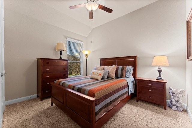 bedroom with light carpet, ceiling fan, baseboards, and lofted ceiling