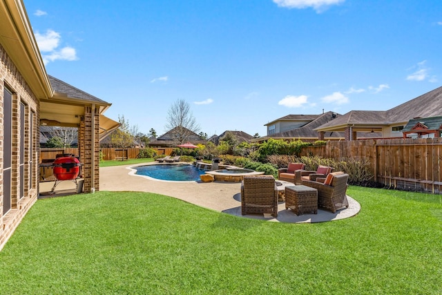 view of yard featuring a patio, a fenced backyard, and a pool with connected hot tub