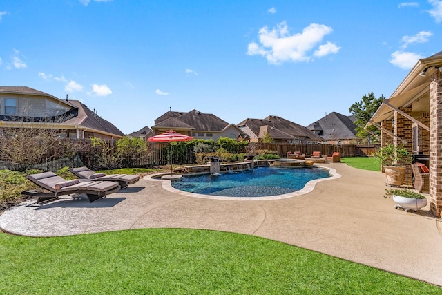 view of pool with a yard, a pool with connected hot tub, a fenced backyard, and a patio area