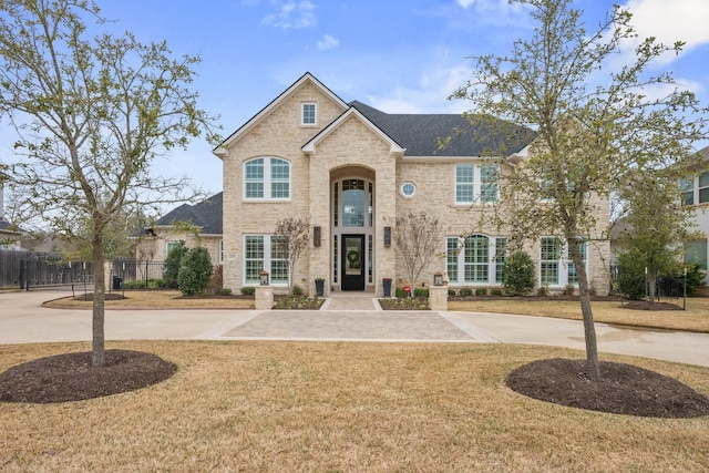 view of front of house featuring a front yard and fence