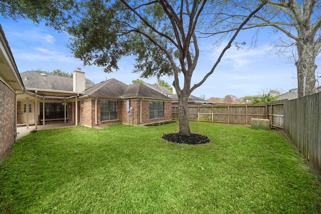 view of yard featuring a patio and a fenced backyard