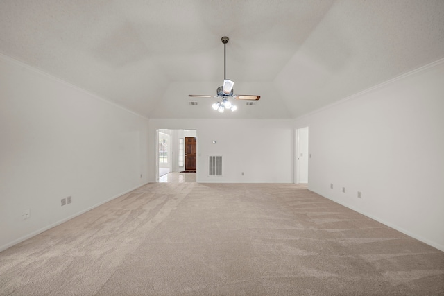 unfurnished living room with visible vents, ceiling fan, carpet, ornamental molding, and vaulted ceiling