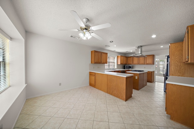 kitchen featuring visible vents, appliances with stainless steel finishes, brown cabinetry, light countertops, and light tile patterned floors