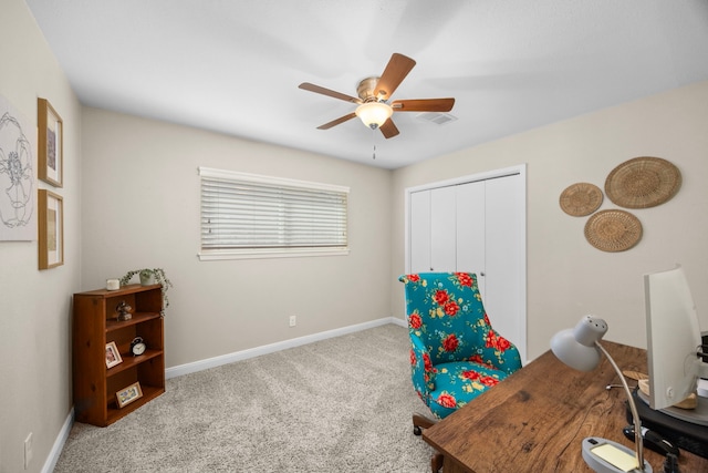 office space featuring visible vents, ceiling fan, baseboards, and carpet