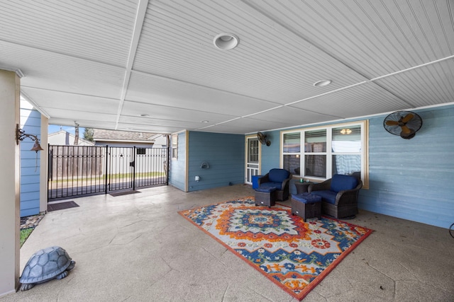 view of patio featuring a gate and fence