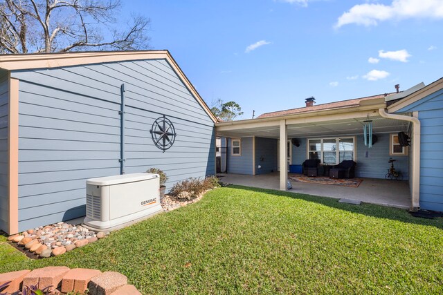 back of house featuring a patio and a lawn