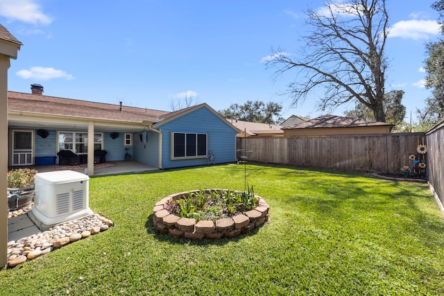 view of yard featuring a patio and a fenced backyard