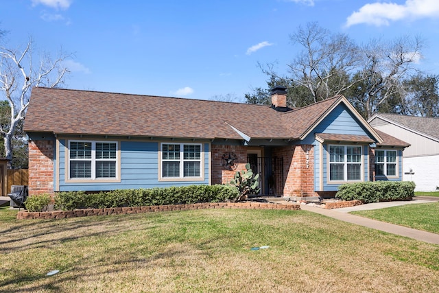 ranch-style house with brick siding, a chimney, a front lawn, and a shingled roof