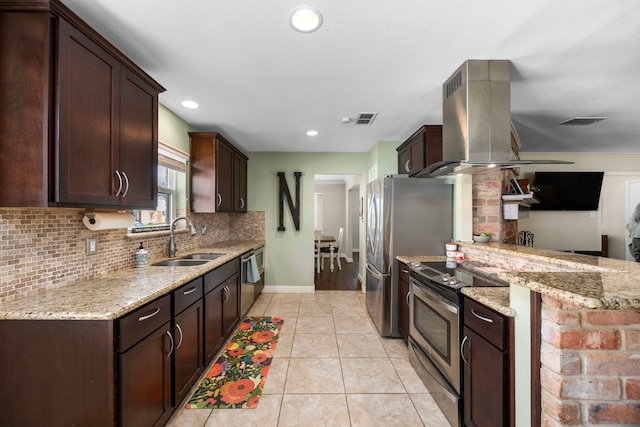 kitchen featuring a sink, stainless steel appliances, visible vents, and island range hood