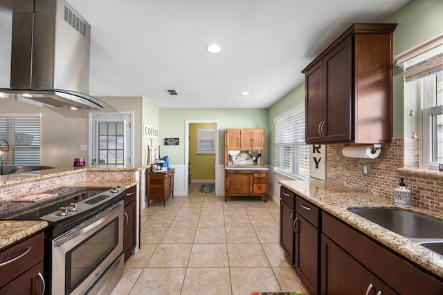 kitchen with visible vents, tasteful backsplash, range hood, stainless steel electric range, and light tile patterned flooring