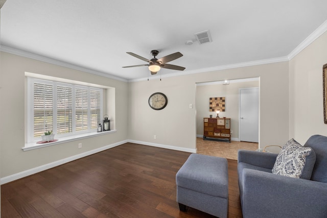 sitting room with baseboards, wood finished floors, visible vents, and ceiling fan