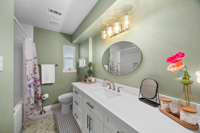 full bath with visible vents, toilet, vanity, and shower / bath combo