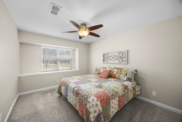 bedroom with visible vents, baseboards, a ceiling fan, and carpet flooring