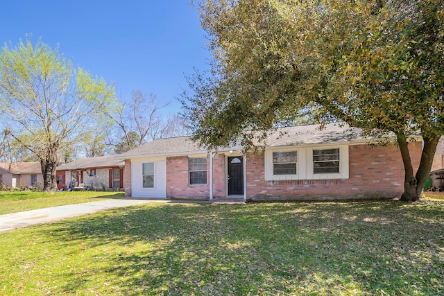 ranch-style house with brick siding and a front yard