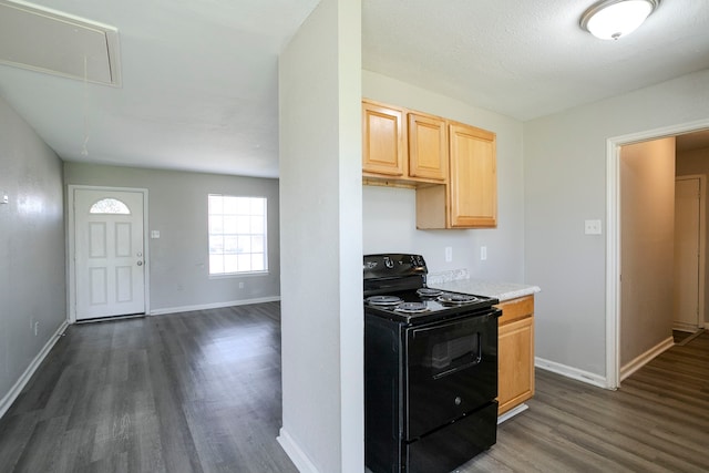 kitchen with light brown cabinetry, black / electric stove, light countertops, baseboards, and dark wood-style flooring