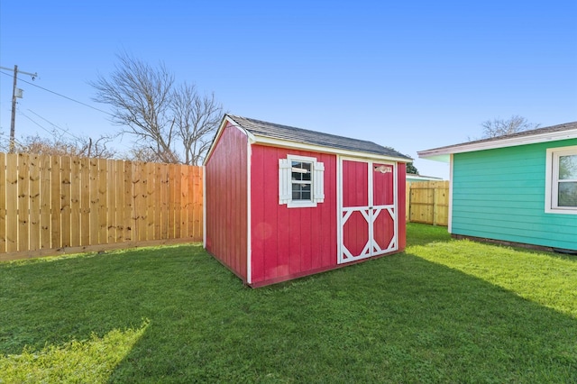 view of shed with a fenced backyard