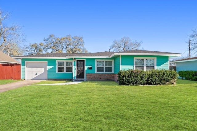 ranch-style house featuring a front lawn, fence, concrete driveway, an attached garage, and brick siding