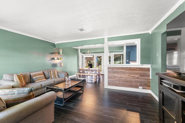 living room with dark wood-type flooring, baseboards, visible vents, and ornamental molding