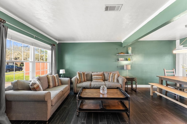 living area featuring visible vents, crown molding, baseboards, and wood tiled floor