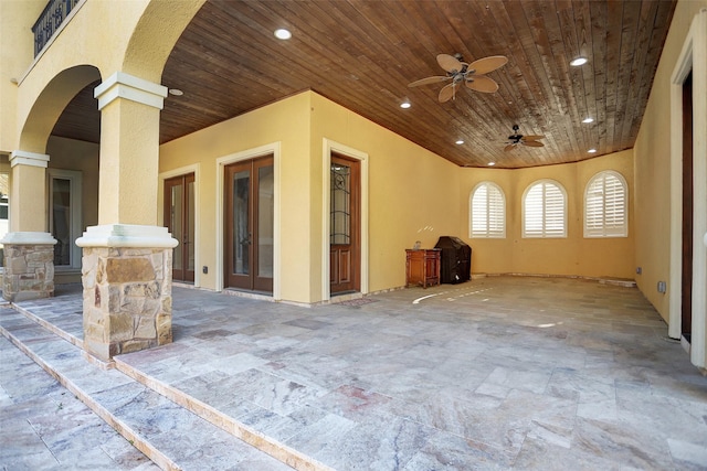 exterior space with french doors and ceiling fan