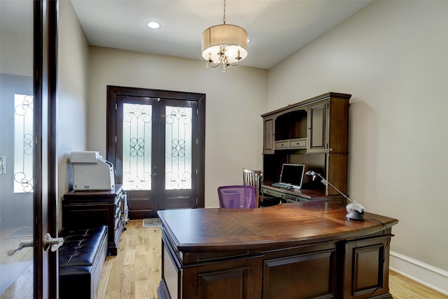 office featuring light wood finished floors, baseboards, recessed lighting, french doors, and an inviting chandelier