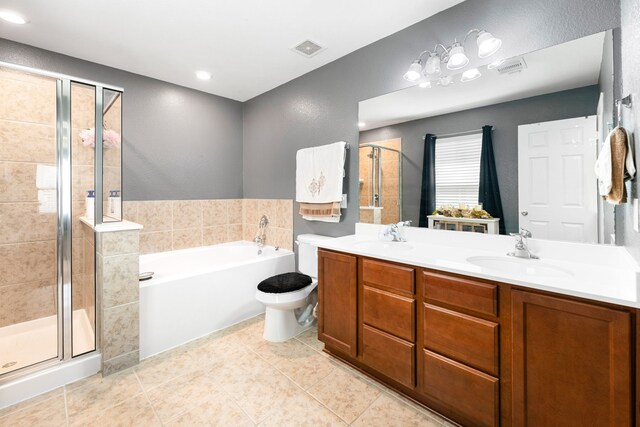 full bath featuring a garden tub, a stall shower, visible vents, and a sink